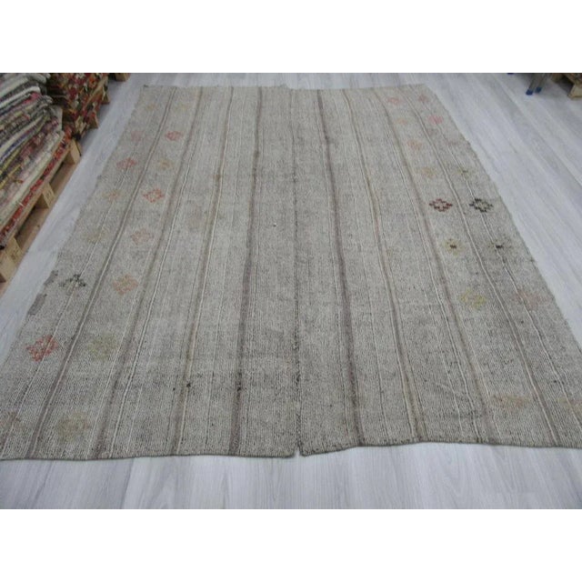 This is a vintage embroidered striped rag rug from the Adana region of Turkey. The piece is approximately 50-60 years old.