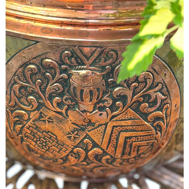 This is a beautiful late 19th century brass and copper hand hammered planter or jardiniere, with lion head mask handles...