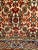A "near square" size hand-knotted vintage Persian Qum area rug in an all-over Herati pattern circa the mid 1900s. The...