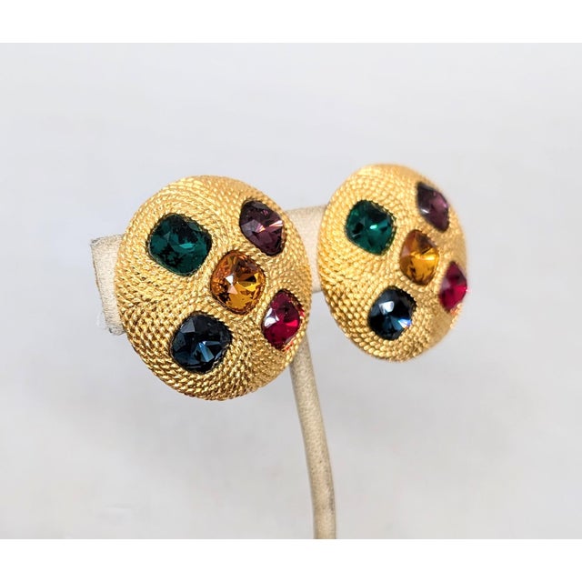 1991 goldtone round domed textured with a faux-citrine center with faux-emerald, faux-sapphire, faux-amethyst and faux-...