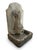 This striking wall-mounted fountain features a stylized, hand-carved aesthetic typical of mid-century architectural garden...