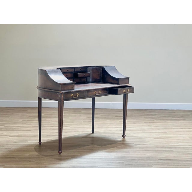 Antique Leather-Lined Oak Writing Desk by Charles Lowe & Sons Handcrafted in Loughborough, Since 1825 Steeped in the grace...