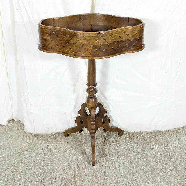 A beautiful 19th century French oval shaped and carved walnut jardinière or planter raised on a turned and carved baluster...