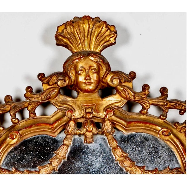 This is a finely carved and gilt Italian Baroque period cartouche mirror that dates to the 3rd quarter of the 18th...