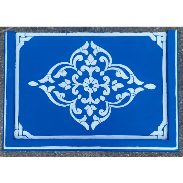 A stunning hand‑painted Moroccan nightstand showcasing the vibrant artistry and traditional Zoua9 woodwork Morocco is...