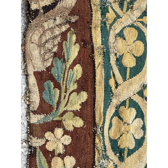 "Exquisite fragment of a border of a French Aubusson tapestry from the middle of the 17th century, featuring a beautiful...