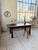 Antique 19th-century castle or dining table in solid oak with a dark patina. We love the simplicity of the tabletop, which...