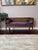 1950s Vintage Mid-Century Modern Cane Back Bench This bench/settee has a cane back and cane side panels with a walnut tone...