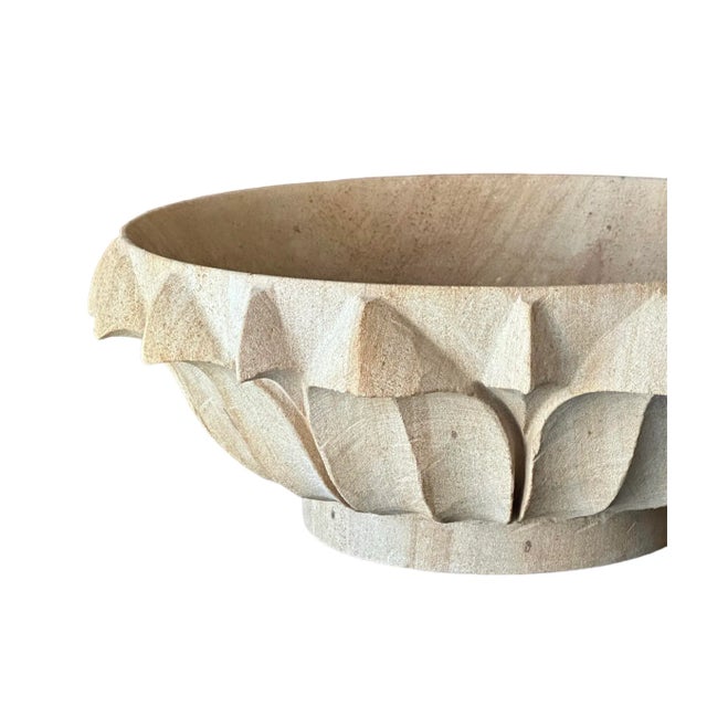 The cemented Italian bowl with delicate petal detailing is a striking blend of rustic charm and intricate craftsmanship....