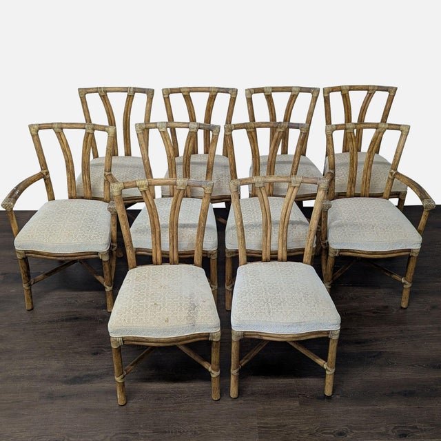 Bamboo/Rattan chairs consisting of 8 side chairs and 2 armchairs, with upholstered seat cushions. Brand: McGuire....