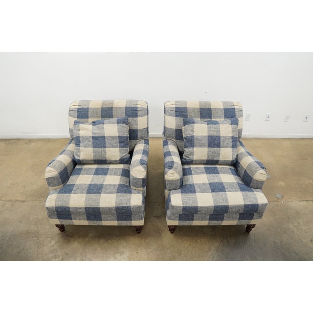 This pair of Pottery Barn lounge chairs features a timeless English roll arm silhouette upholstered in a classic blue and...