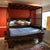 Brown Ornate Hand Carved Chinese Canopy Wedding Bed With Mirrored Sideboard For Sale - Image 8 of 15
