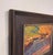 The painting captures a tranquil late afternoon scene at Taos Pueblo, where warm sunlight bathes the landscape in golden...