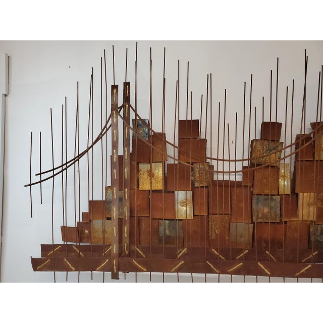 Here for you this great Jere wall sculpture. Featuring a cityscape, in the background buildings formed by blocks and in...