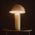 Channeling an iconic mid-century silhouette, The Apollo Table Lamp is defined by its sculptural mushroom-dome shade....
