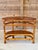 An authentic 1940s tropical modernist demilune side table from the highly collectible "Rattanage" line, manufactured by La...