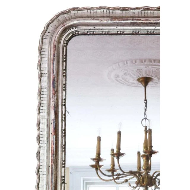 Antique fine quality large silver gilt 19th Century overmantle or wall mirror with a lovely charm and elegance. This is a...