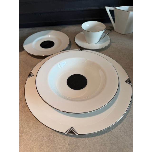A striking and complete 14‑place‑setting service of 1987 Sasaki Fine China, showcasing the brand’s iconic late‑80s...