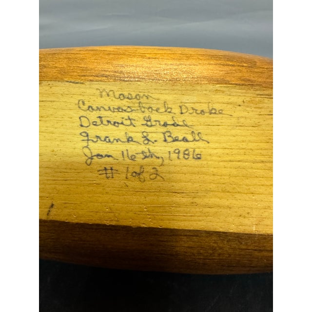 The product is a vintage Frank L. Beall 1986 signed wooden mason duck decoy. This canvasback decoy is made of solid wood...