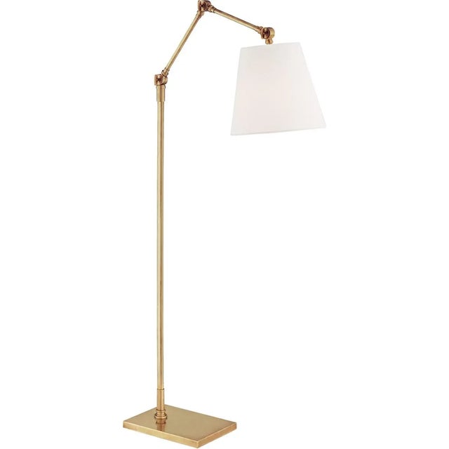 Graves Articulating Floor Lamp in Hand-Rubbed Antique Brass with Linen Shade Designer: Suzanne Kasler Height: 50" - 58.75"...