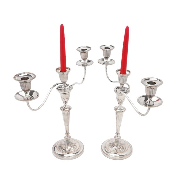 A pair of English candelabra from the George III period, made around 1780-90 in Old Sheffield Plate, in the Neoclassical...