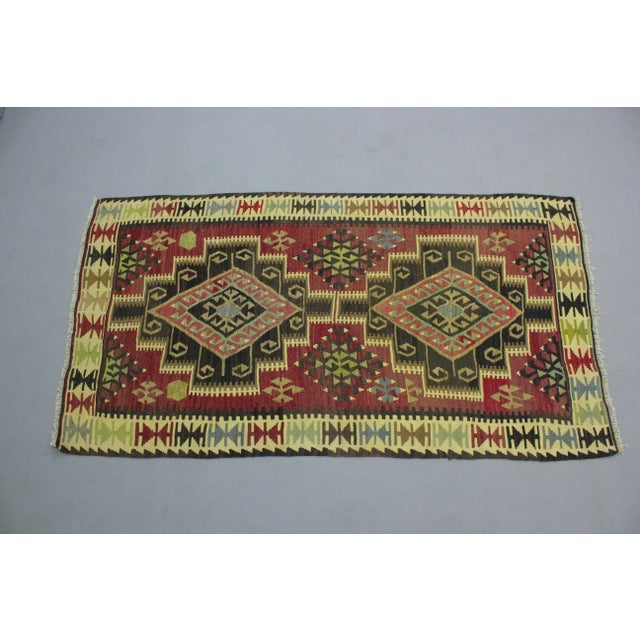 1960s Rustic Style Cappadocia Handmade Wool Turkish Kilim Rug Size: 3.5 x 6.4 ft - 105 x 195 cm - 41 x 76 inches Color:...