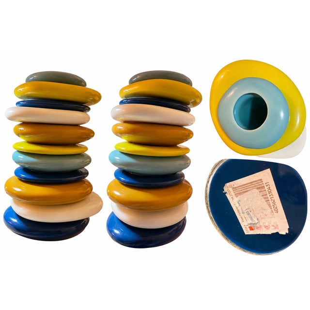 A striking sculptural “Pebbles Colore” vase by KARE Design, featuring a playful stacked-pebble form in a sophisticated mix...