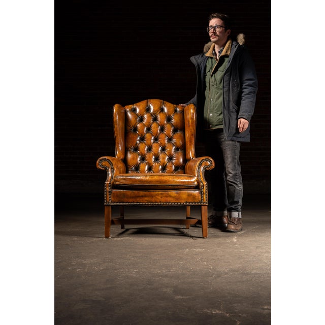 c. 1990s/2000s; LeatherCraft, Inc. - Toronto, ON Traditional leather wingback armchair featuring a tall deeply button-...