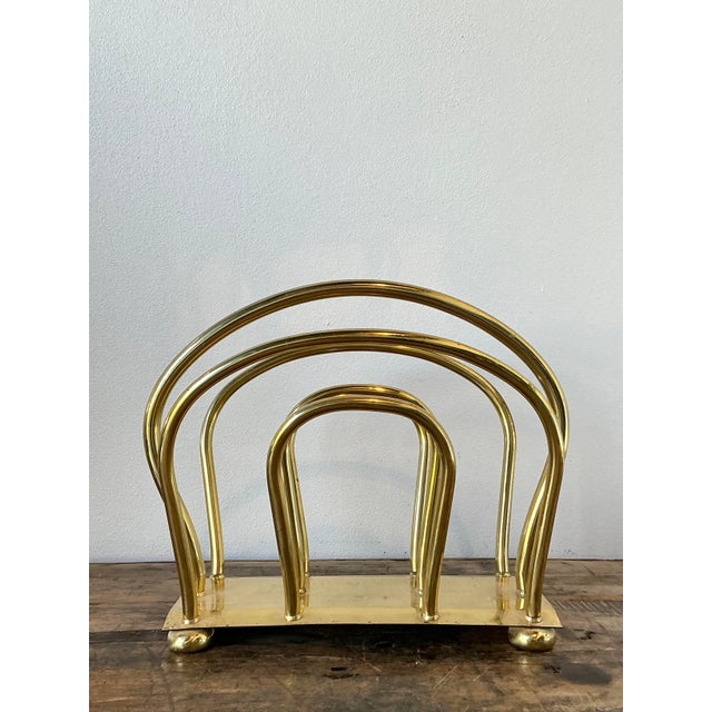 This stunning vintage magazine rack, designed in the glamorous manner of Dorothy Draper, exudes Hollywood Regency...