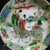 Vibrant Chinese wucai porcelain display plate hand painted with a classical figural scene of immortals, featuring robed...