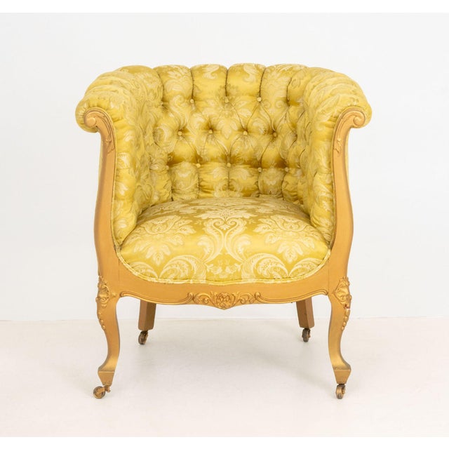 Louis XVI Style Giltwood Tub Chair, with yellow damask upholstery on carved cabriole legs on casters. 32" H x 29" W x 25"...