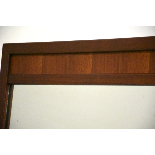 A walnut mid century modern mirror
