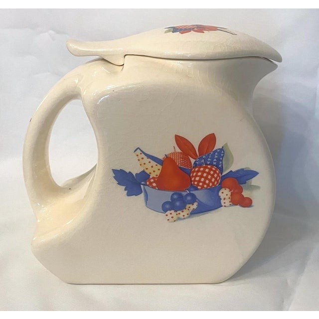 Universal Cambridge ceramic refrigerator pitcher, c. 1930's. Adorable fruit basket pattern in patriotic colors. Perfect...