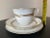 A beautiful coffee or tea porcelain cup and two saucers set, by Royal Worcester, 20th century, England, Europe. Piece has...