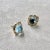 Created in 18 karat yellow gold Blue topaz 6 carats approx. Champagne diamonds 0.09 carat approx. Post backs for pierced...