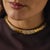 This exceptional vintage choker necklace is a bold and luxurious statement piece from the 1980’s, crafted in rich 18k...