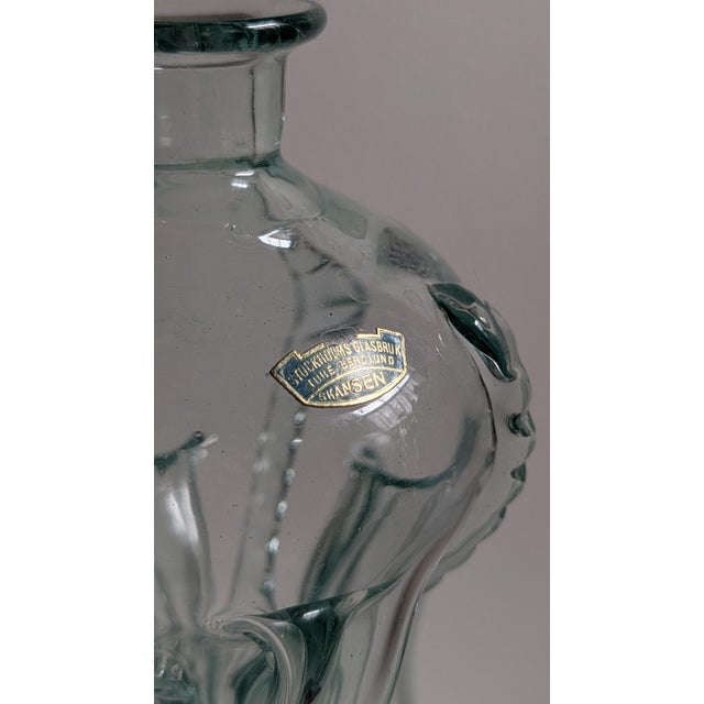 Authentic vintage "Kluk Kluk" glass decanter designed by Ture Berglund and produced by Skansens Glasbruk in Sweden, dating...