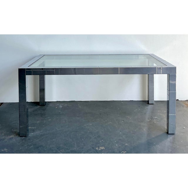 This monumental vintage dining table is a masterclass in 1970s high-drama modernism, capturing the architectural...
