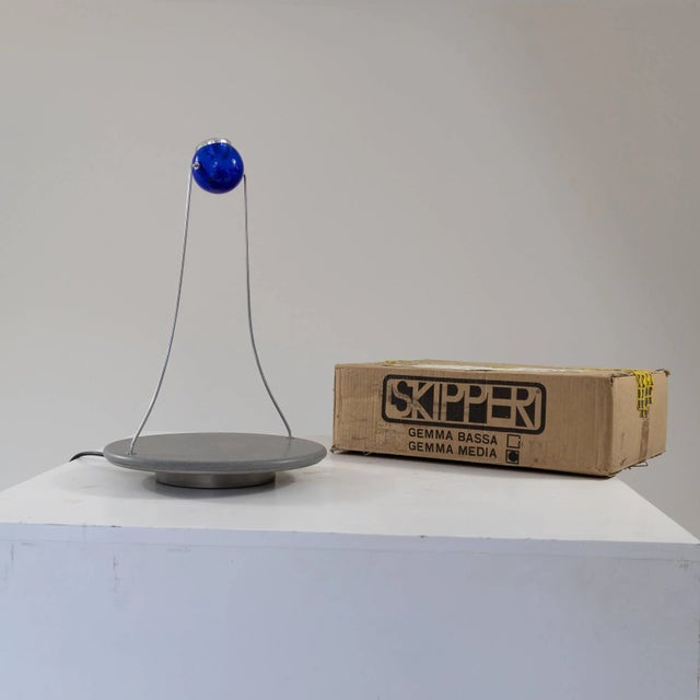 Table lamp model “Gemma”, large size, manufactured by Skipper. Granite base and blue coloured plexyglass diffuser....