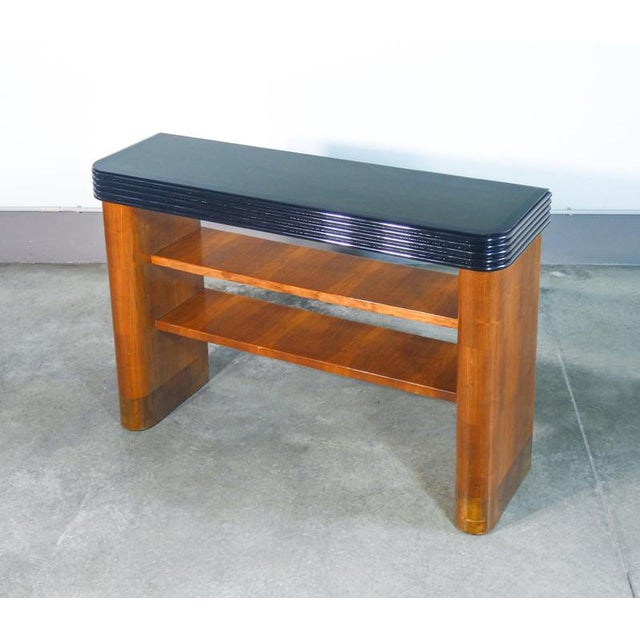 Art deco console table, italian design, in wood, with ebonized frame and glass top. Italy, 1930s origin italy period 1930s...
