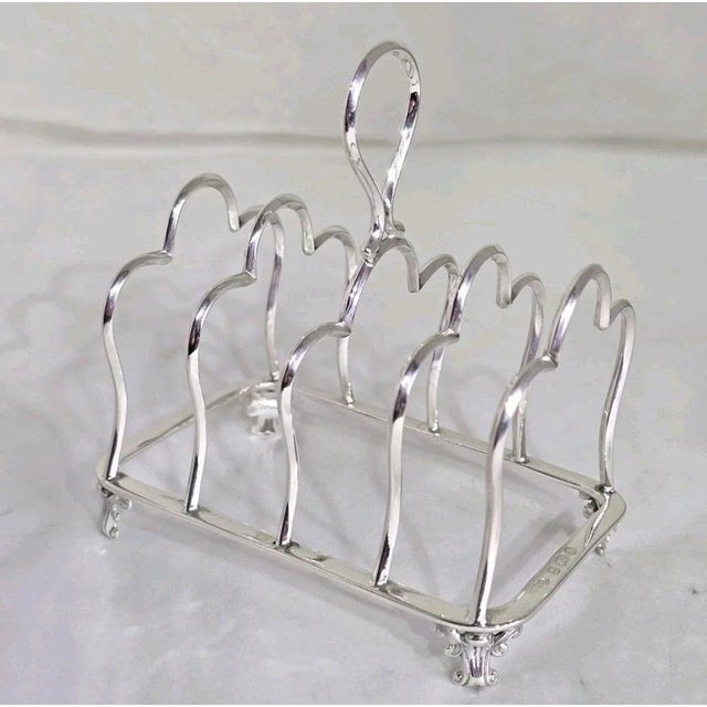 An Edwardian sterling silver five-bar toast rack by Marples & Co., hallmarked Birmingham 1901. Designed in Gothic arch...