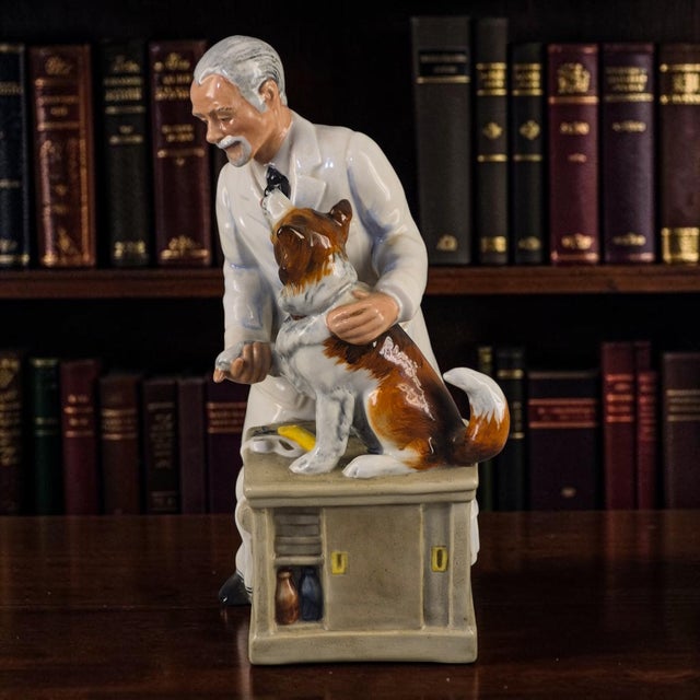The Royal Doulton Figurine "Thanks Doc" is a beautifully crafted porcelain figurine depicting a dog, specifically designed...