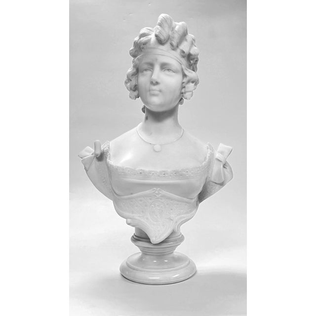 Fine antique (19th century) continental bust of a lovely female in curls and dress adorned with bows at the shoulder....