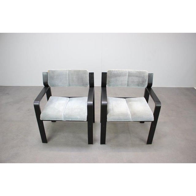 A distinctive pair of vintage armchairs designed by Ludvik Volak and manufactured by Dřevopodnik Holešov in Czechoslovakia...