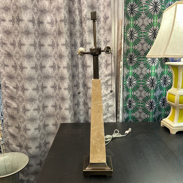 Fine obelisk shape travertine and bronze metal finish tabletop lamp. The square finial tops off this very attractive lamp....
