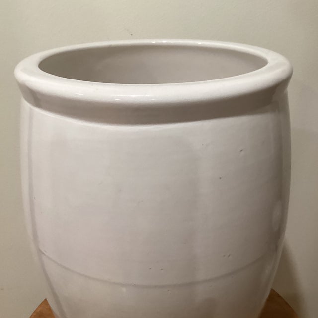 This ceramic jar planter is handcrafted and finished in a glossy white glaze. Made from heavy and durable red clay. Can be...