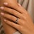 14k white gold eternity band ring with 1.80 carats of blue round sapphires and 1.30 carats of white round diamonds. 3.85g,...
