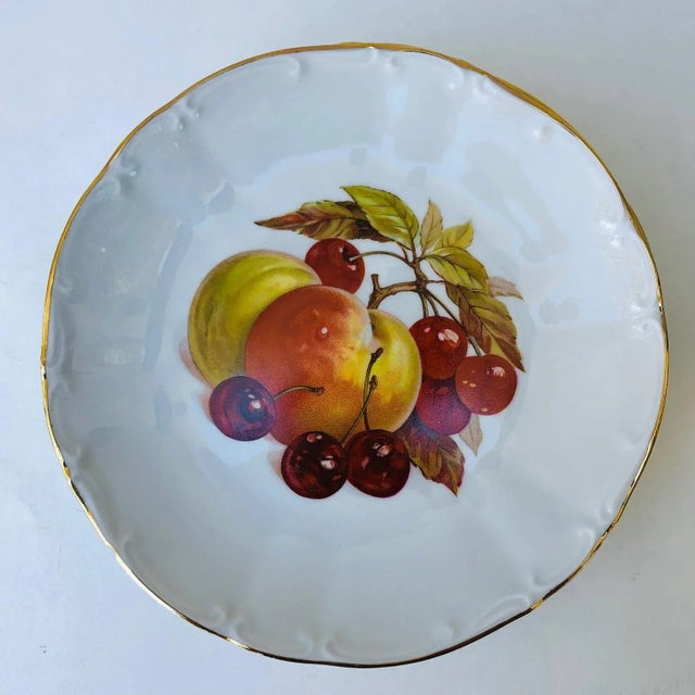 A quite beautiful set of six Bavarian Bareuther Waldsassen plates each one is gold rimmed with a different hand-painted...