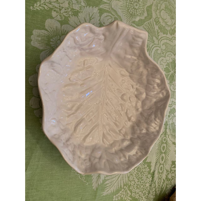 Here we have a beautiful white majolica cabbage leaf bowl. Made in Portugal by Secla which began business in 1947....