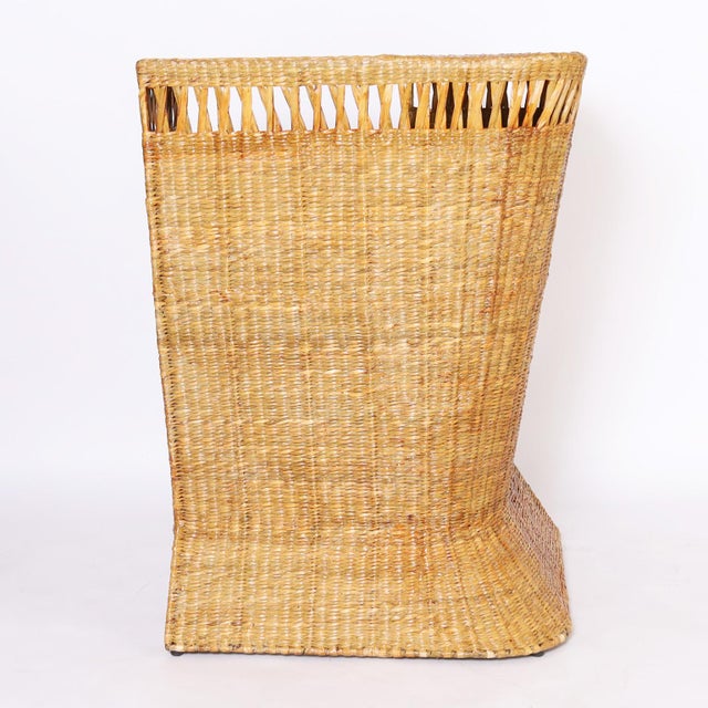 One of a kind mid century inspired tropical bar hand crafted with a sturdy frame wrapped in reed with plenty of storage...